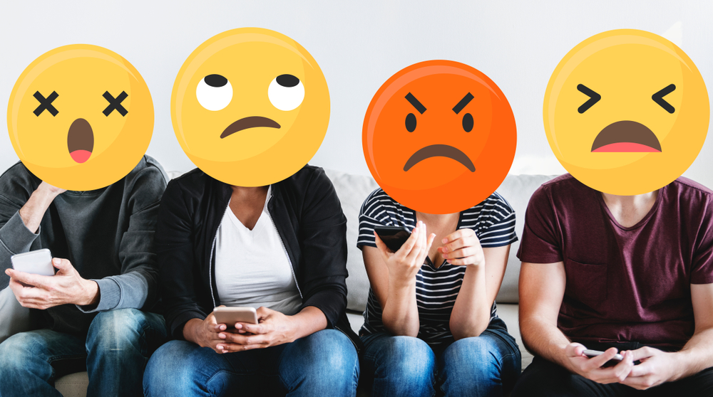 diverse group of people with negative emojis for faces