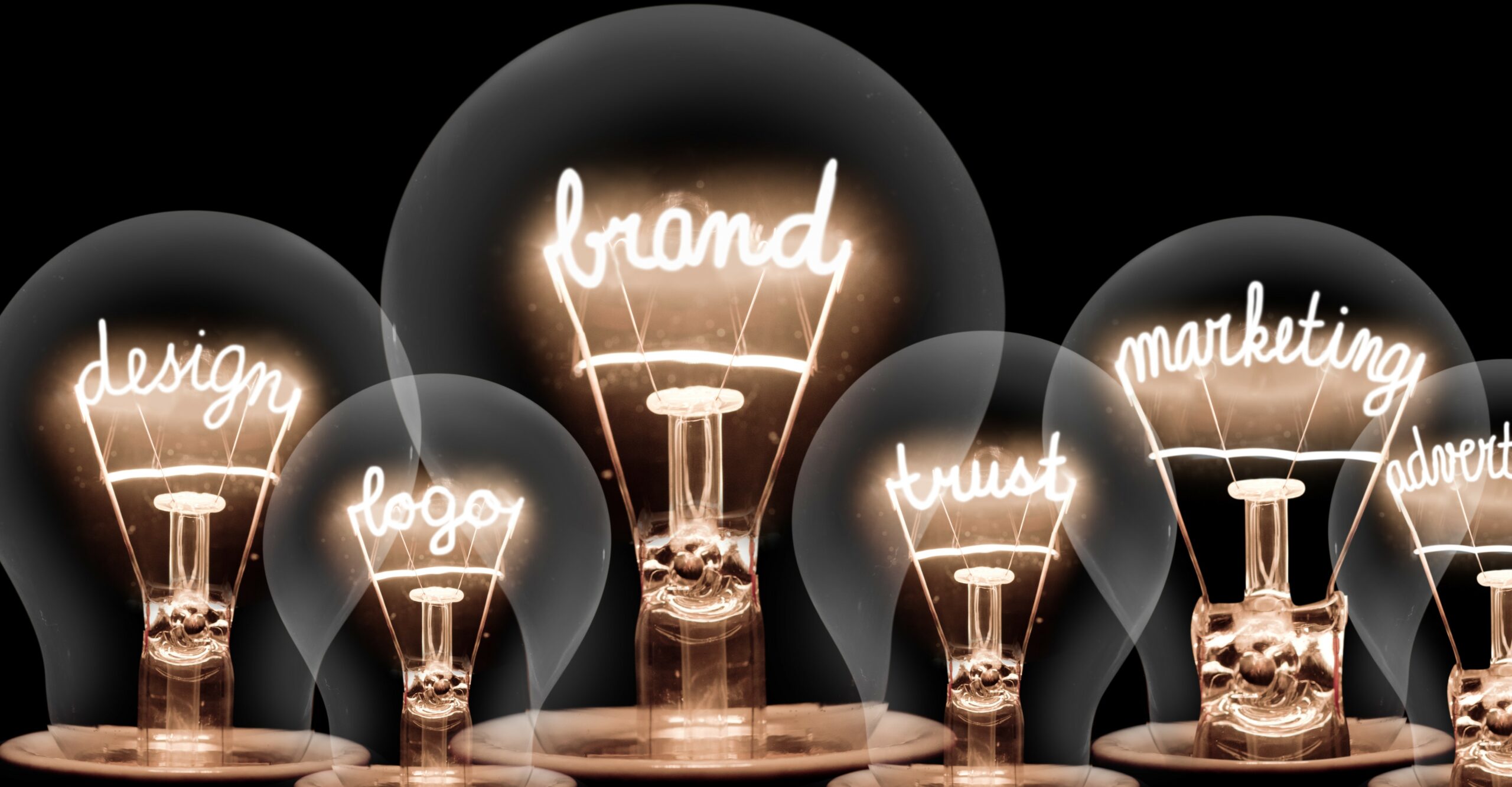 A row of lightbulbs displaying various brand related words